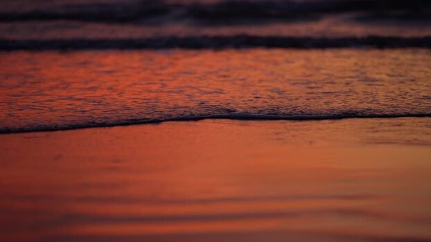 View of gentle waves at sunset in Bangladesh. View of gentle waves at sunset in Bangladesh.