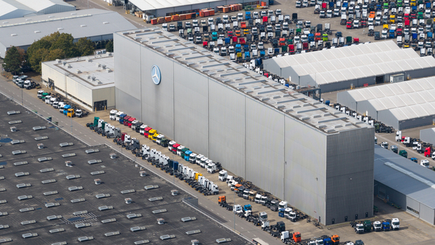 Worth am Rhein Germany 19 September 2026 Aerial view of the Mercedes Benz Werk Worth administration building surrounded by rows of parked trucks and industrial facilities.