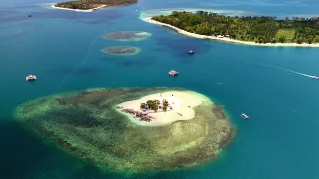 Aerial view of Gili Bedis island and turquoise waters Indonesia. Aerial view of Gili Bedis island and turquoise waters Indonesia.