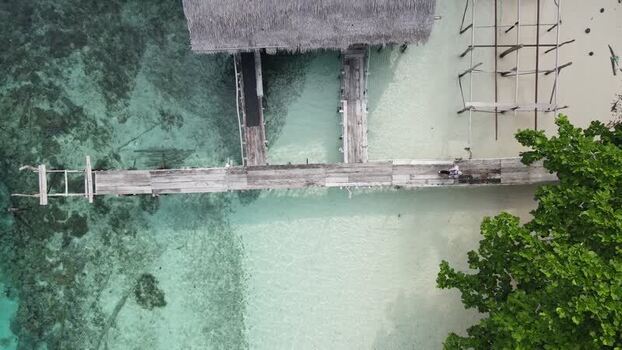 Aerial view of wooden pier in Raja Ampat Indonesia. Aerial view of wooden pier in Raja Ampat Indonesia.