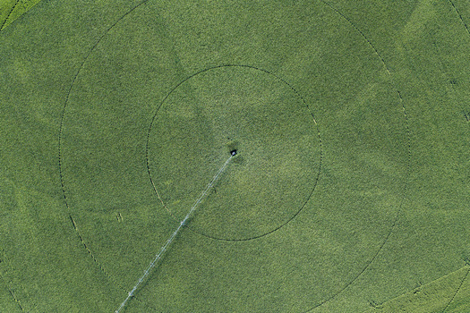 Aerial view of a center pivot irrigation system in a lush green agricultural field in Hombourg Grand Est France. Aerial view of a center pivot irrigation system in a lush green agricultural field in Hombourg Grand Est France.