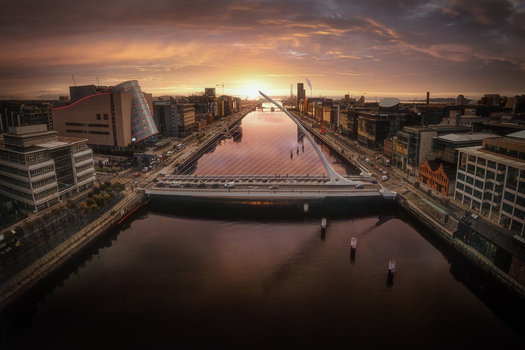 Aerial view of Samuel Beckett Bridge and the Convention Centre Dublin at North Wall Quay during a vibrant sunset over the River Liffey in Dublin 1 County Dublin Ireland.