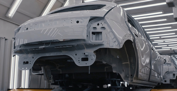 View of a car body frame on an assembly line in a modern automotive manufacturing factory in Jilin City Jilin China. View of a car body frame on an assembly line in a modern automotive manufacturing factory in Jilin City Jilin China.