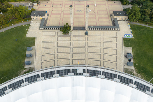 Berlin Germany 26 September 2026 Aerial view of the Olympiastadion Berlin showing the iconic stadium roof the paved plaza with the twin towers and the surrounding green parkland.