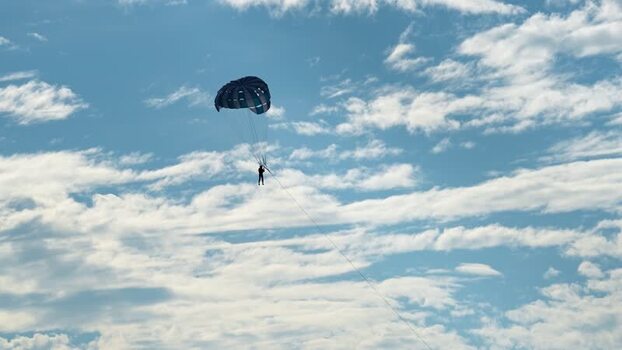 View of a person parasailing in the blue sky Bangladesh.