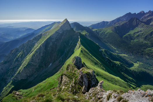 View of the sharp peak of Zdiarska vidla in the Belianske Tatry mountains with lush green slopes and rocky outcrops under a clear blue sky Zdiar Presov Region Slovakia. View of the sharp peak of Zdiarska vidla in the Belianske Tatry mountains with lush green slopes and rocky outcrops under a clear blue sky Zdiar Presov Region Slovakia.