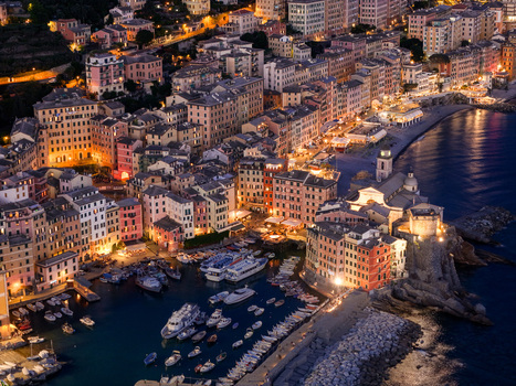 Aerial view of the illuminated historic harbor and colorful buildings at dusk Camogli Liguria Italy. Aerial view of the illuminated historic harbor and colorful buildings at dusk Camogli Liguria Italy.
