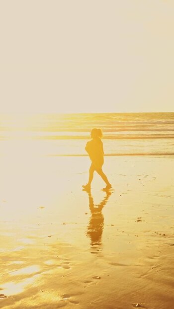 View of a golden beach at sunset New Zealand. View of a golden beach at sunset New Zealand.