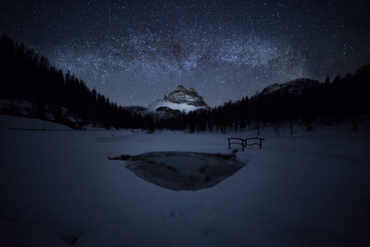 View of the snow covered Dolomites under a starry night sky with the Milky Way above Tre Cime di Lavaredo Trentino Alto Adige Italy. View of the snow covered Dolomites under a starry night sky with the Milky Way above Tre Cime di Lavaredo Trentino Alto Adige Italy.