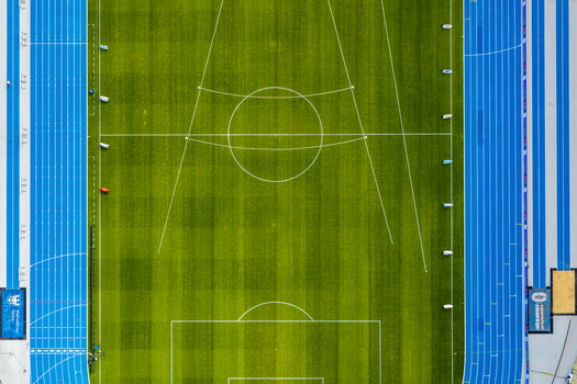 Chorzow Poland 17 September 2026 Aerial view of Silesian Stadium featuring the vibrant blue running track surrounding the green football pitch with white field markings.