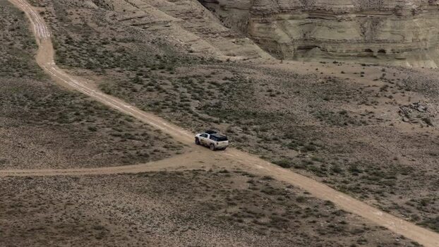 Aerial view of a vehicle on a desert track in Bozjyra Kazakhstan.