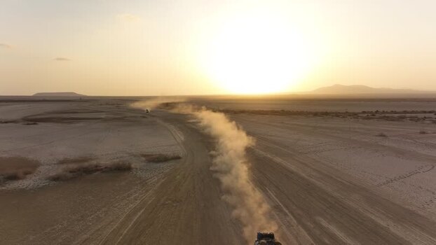 Aerial view of a vehicle kicking up dust in the Danakil Desert Ethiopia.