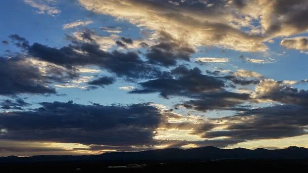 Aerial view of golden sunset clouds over Los Alamos United States.