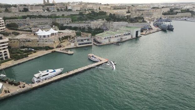 Aerial view of yachts by historic fortifications Malta.