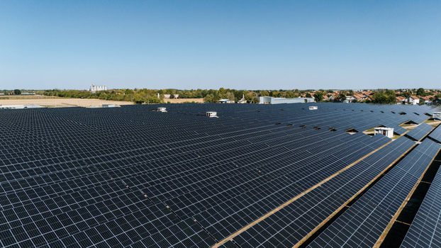 Aerial view of a large solar farm with rows of photovoltaic panels under a clear blue sky in Temerin Vojvodina Serbia. Aerial view of a large solar farm with rows of photovoltaic panels under a clear blue sky in Temerin Vojvodina Serbia.