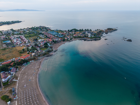 Aerial view of Arapya beach with its turquoise waters sandy shoreline and surrounding resort buildings along the coast in Burgas Bulgaria. Aerial view of Arapya beach with its turquoise waters sandy shoreline and surrounding resort buildings along the coast in Burgas Bulgaria.