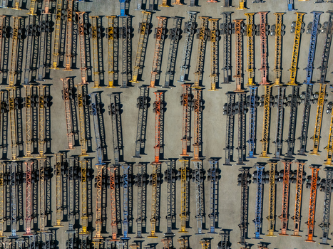Aerial view of rows of shipping container chassis parked in an industrial storage yard in Carson California United States.