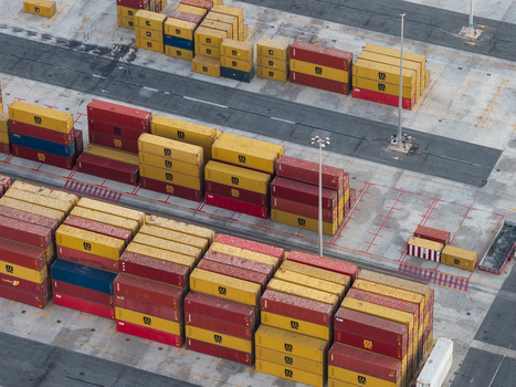 Civitavecchia Lazio Italy 22 August 2026 Aerial view of Civitavecchia Port featuring rows of stacked colorful shipping containers on the concrete terminal ground.
