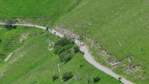 Aerial view of people on a path in Castelluccio Italy.
