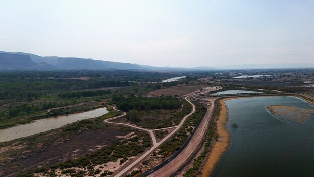 Grand Junction United States 03 July 2026 Aerial view of retention ponds surrounded by arid landscape walking paths and distant mesas under a clear sky. Grand Junction United States 03 July 2026 Aerial view of retention ponds surrounded by arid landscape walking paths and distant mesas under a clear sky.