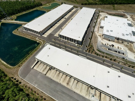 Aerial view of large industrial warehouses and distribution centers near Saint Johns Parkway and International Golf Parkway World Golf Village Florida United States. Aerial view of large industrial warehouses and distribution centers near Saint Johns Parkway and International Golf Parkway World Golf Village Florida United States.