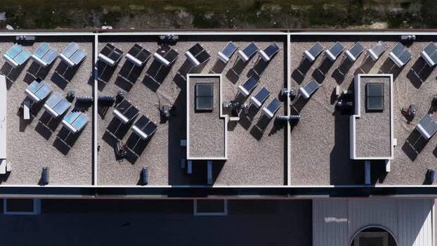 Aerial view of decentralized rooftop solar panels Portugal.