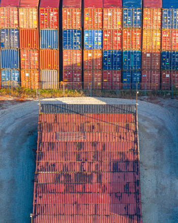 Aerial view of a large stack of colorful cargo containers arranged in a shipping yard in Warsaw Masovian Voivodeship Poland.
