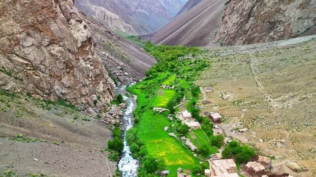 Aerial view of Qullai Vudor and the lush valley Tajikistan. Aerial view of Qullai Vudor and the lush valley Tajikistan.