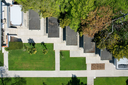 Aerial view of modern architecture featuring flat roofs green lawns and lush trees in Morges Vaud Switzerland. Aerial view of modern architecture featuring flat roofs green lawns and lush trees in Morges Vaud Switzerland.