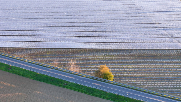 Aerial view of polytunnel fruit growing structures protecting crops in the Po Valley near a road in Fiorenzuola d Arda Emilia Romagna Italy. Aerial view of polytunnel fruit growing structures protecting crops in the Po Valley near a road in Fiorenzuola d Arda Emilia Romagna Italy.