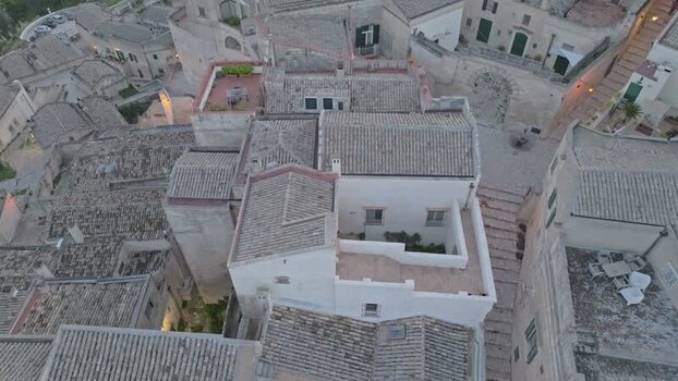 Aerial view of Matera stone rooftops in Italy.