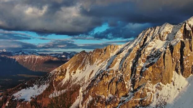 Aerial view of Dolomite Mountains peaks in Canazei Italy.