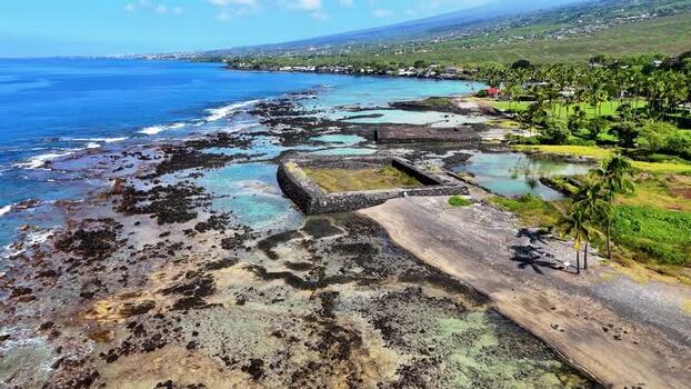 Aerial view of Kahalu u Beach Park and volcanic coastline United States.