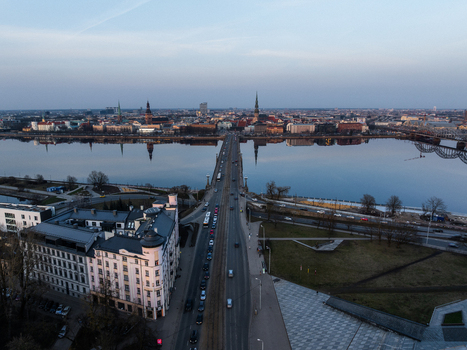 Aerial view of Akmens tilts bridge crossing the Daugava river towards the historic skyline of Old Riga Riga Latvia. Aerial view of Akmens tilts bridge crossing the Daugava river towards the historic skyline of Old Riga Riga Latvia.