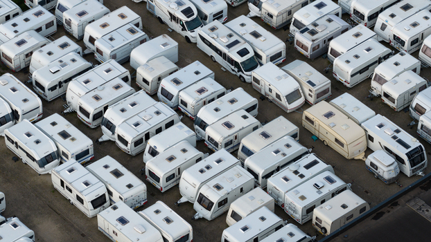 Purmerend Netherlands 15 June 2026 Aerial view of rows of white caravans and motorhomes parked in a storage lot. Purmerend Netherlands 15 June 2026 Aerial view of rows of white caravans and motorhomes parked in a storage lot.