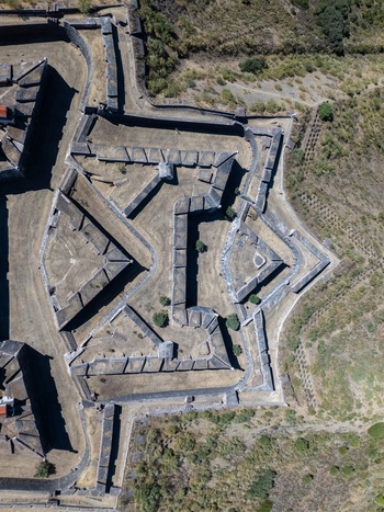 Elvas Portugal 10 September 2026 Aerial view of the star shaped Forte de Nossa Senhora da Graca with historic stone walls and bastions set in the dry landscape. Elvas Portugal 10 September 2026 Aerial view of the star shaped Forte de Nossa Senhora da Graca with historic stone walls and bastions set in the dry landscape.