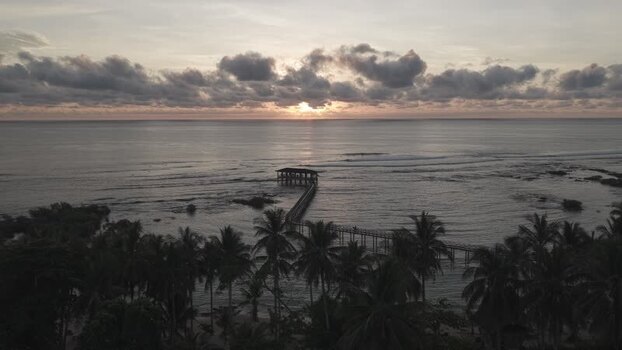 Aerial view of Cloud 9 surfing pier at sunset Philippines. Aerial view of Cloud 9 surfing pier at sunset Philippines.