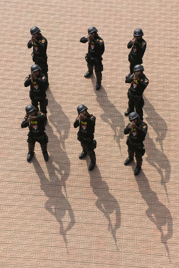 Dhaka Bangladesh 06 January 2017 View of Rapid Action Battalion RAB officers in black tactical gear aiming rifles during a training exercise at the RAB Headquarters. Dhaka Bangladesh 06 January 2017 View of Rapid Action Battalion RAB officers in black tactical gear aiming rifles during a training exercise at the RAB Headquarters.