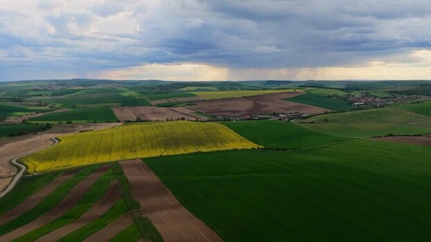 Aerial view of rolling hills and agricultural fields Czechia.