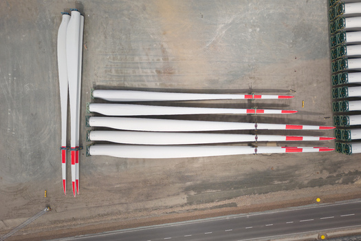 Aerial view of rows of wind turbine blades stored at Esbjerg Port waiting for transport to offshore wind farms in Esbjerg Syddanmark Denmark.