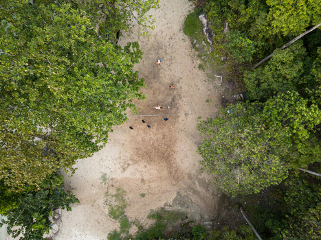 Aerial view of the sandy beach and surrounding lush greenery creating a striking contrast Tanjung Gelam Beach Karimunjawa Central Java Indonesia. Aerial view of the sandy beach and surrounding lush greenery creating a striking contrast Tanjung Gelam Beach Karimunjawa Central Java Indonesia.