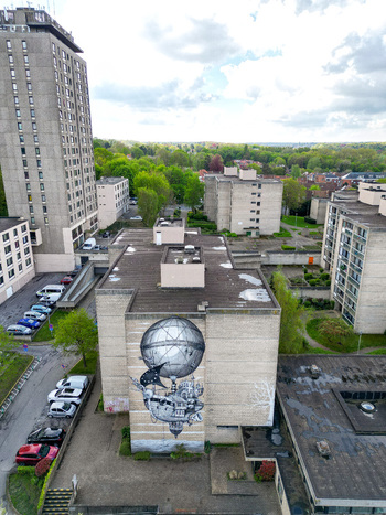 Aerial view of a large steampunk mural on a residential building surrounded by urban architecture and lush green trees Woluwe Saint Lambert Bruxelles Belgium. Aerial view of a large steampunk mural on a residential building surrounded by urban architecture and lush green trees Woluwe Saint Lambert Bruxelles Belgium.