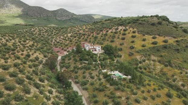 Aerial view of a white villa on a hillside Spain.