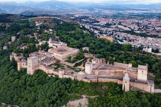 Aerial view of the Alhambra fortress complex with its historic palaces stone walls and lush gardens Alhambra Spain.