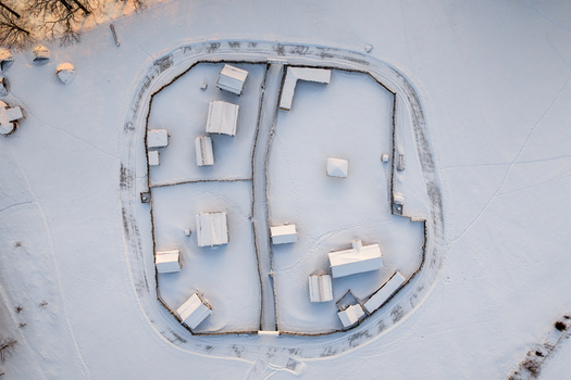 Aerial view of the snow covered historical wooden settlement and fences at Kernave Archaeological Site during winter Kernave Vilnius County Lithuania.