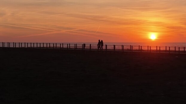 Aerial view of two silhouetted people Portugal.