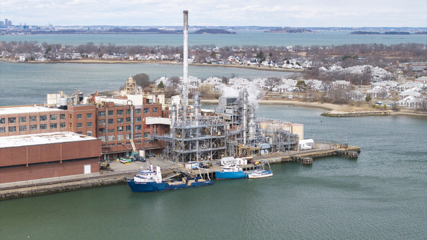 Aerial view of the industrial complex on the water s edge juxtaposing the stark grey infrastructure with the calm blue sea Quincy Massachusetts United States.