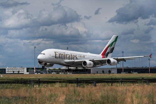 Berlin Germany 09 June 2026 View of an Emirates Airbus A380 landing at the ILA Berlin Air Show with a cloudy sky in the background.