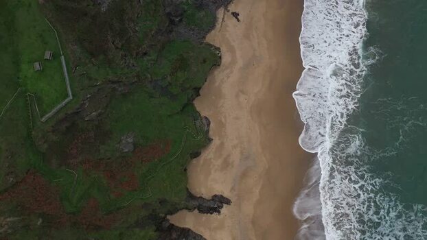 Aerial view of the rugged cliffs and sandy beach in Loiba Spain. Aerial view of the rugged cliffs and sandy beach in Loiba Spain.