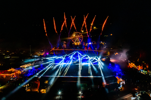 Herzogenaurach Germany 27 July 2025 Aerial view of Open Beatz Festival with vibrant stage lights pyrotechnics and a Ferris wheel at night. Herzogenaurach Germany 27 July 2025 Aerial view of Open Beatz Festival with vibrant stage lights pyrotechnics and a Ferris wheel at night.